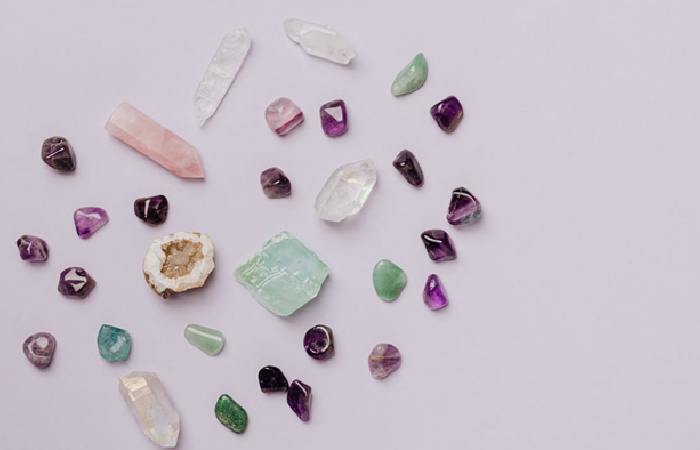 assorted birthstones on a white surface 